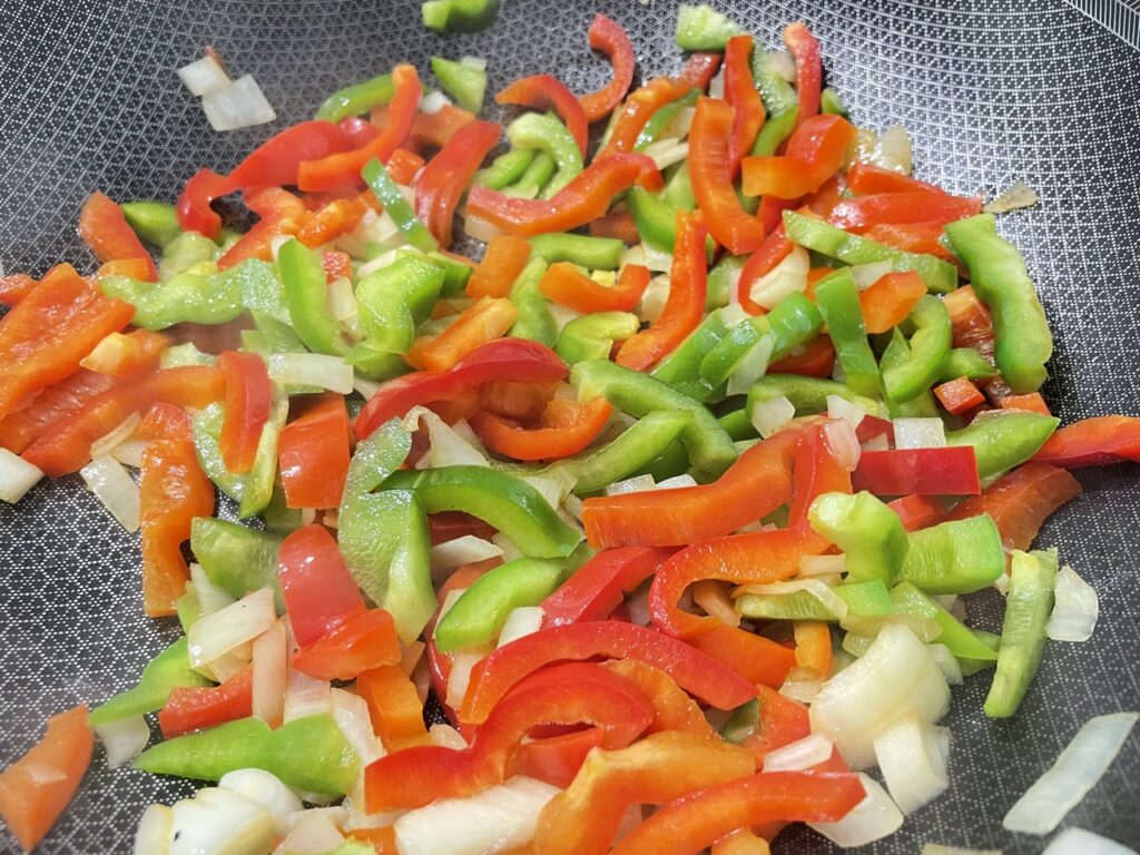 Red and green capsicum with onion