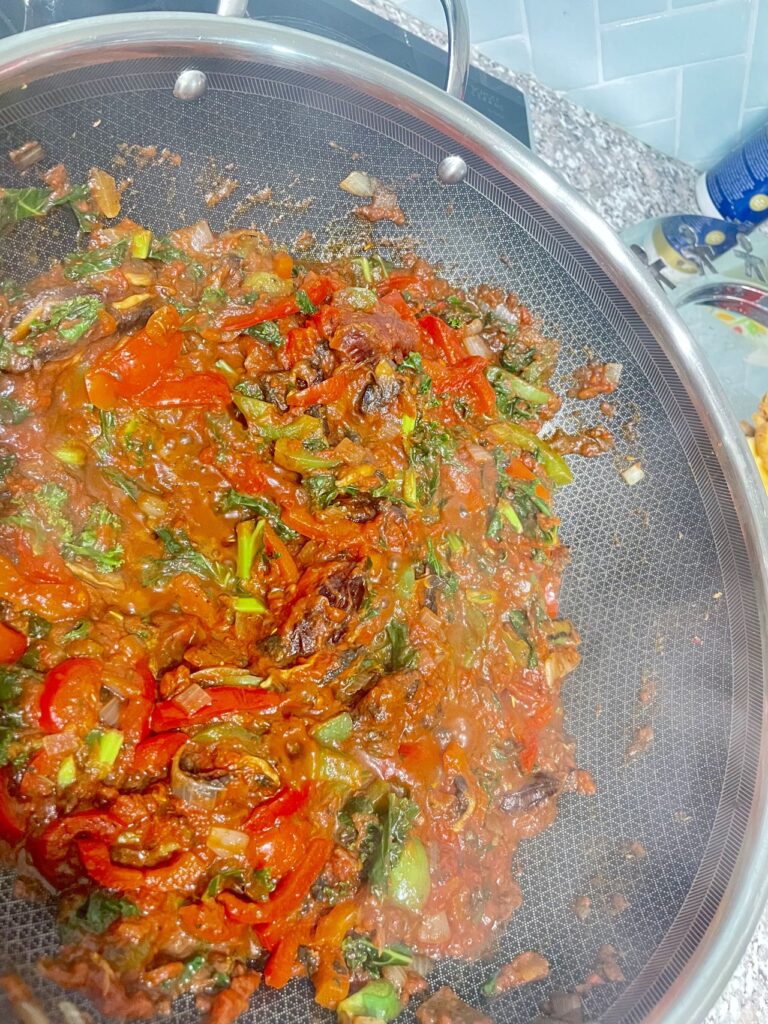 Frying pan with vegetables and sauce