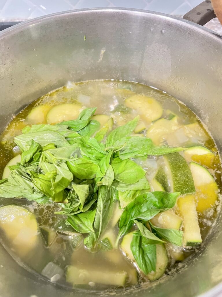 Courgette and Basil Soup Being cooked in silver pot