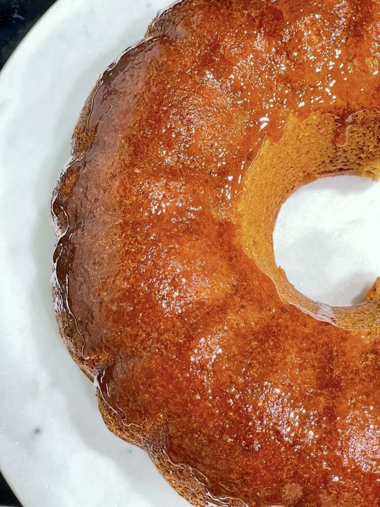 Top down shot of half a bundt cake on marble tray