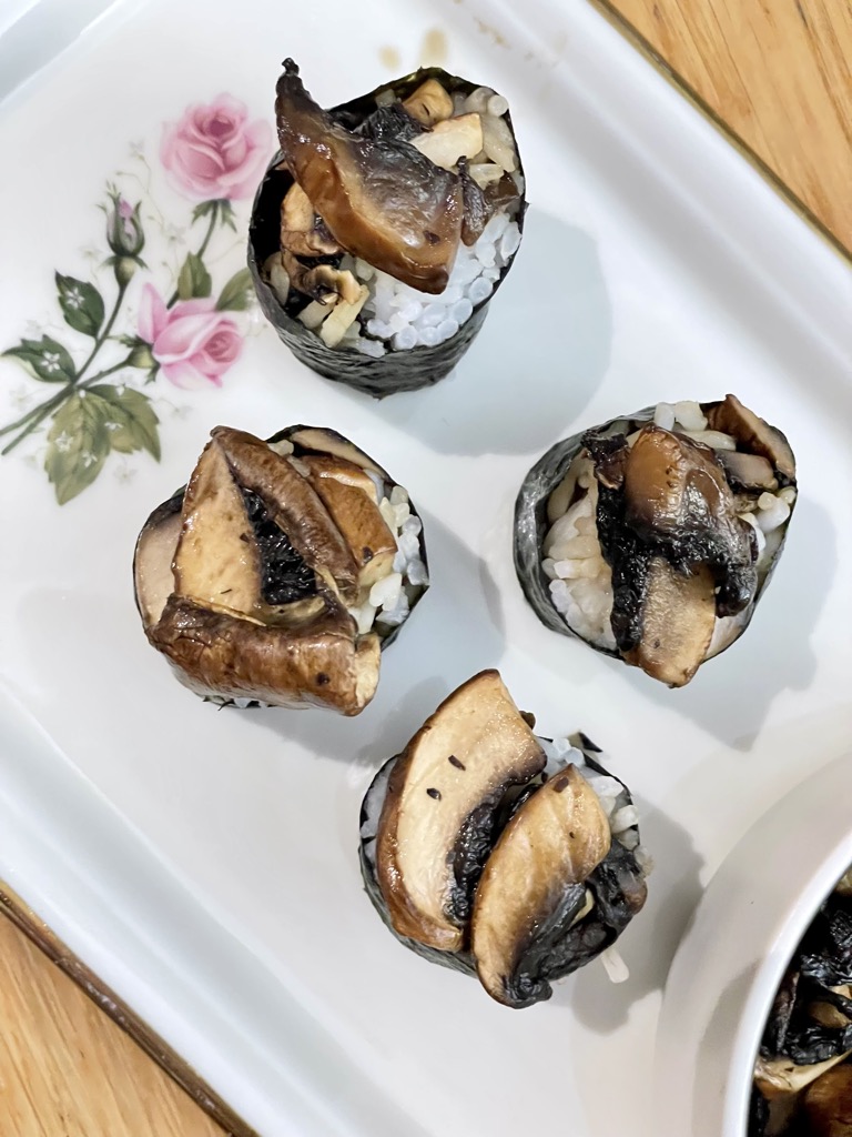 Top down shot of four pieces of mushroom sushi