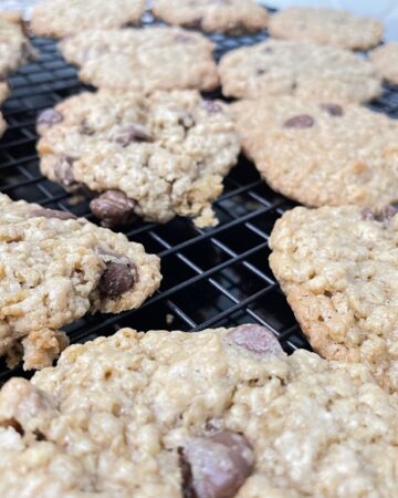 Cooling rack of chocolate chip oatmeal cookies