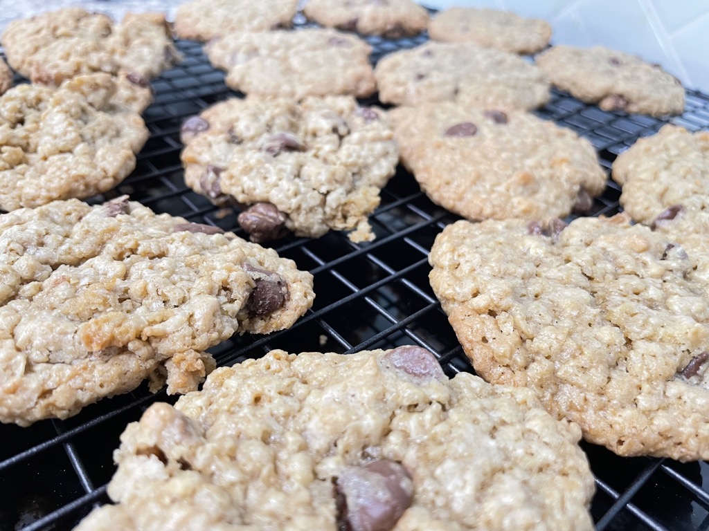 Cooling rack of chocolate chip oatmeal cookies