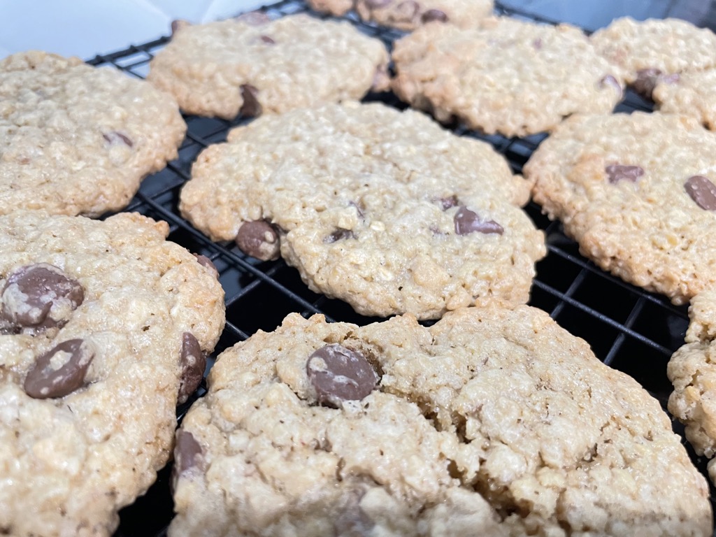 Close up shot of chocolate chip oatmeal cookies on cooling rack