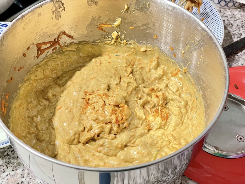 sourdough discard carrot cake dough in silver bowl