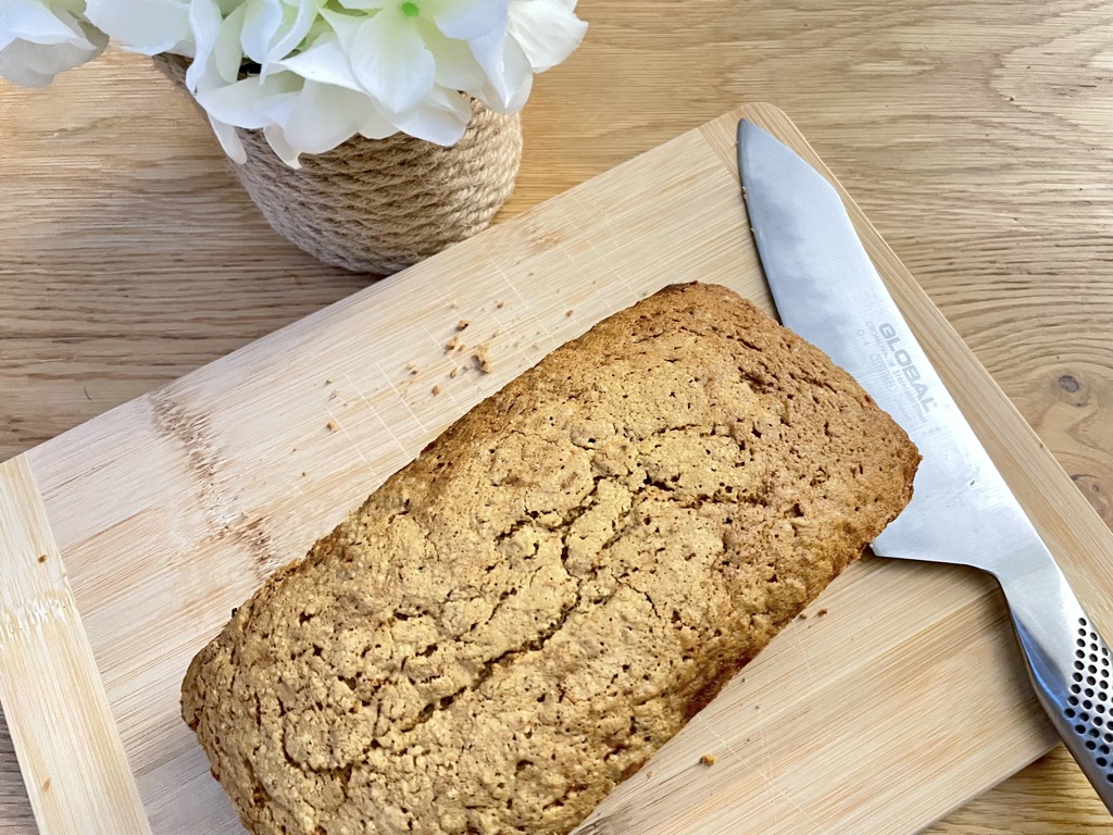 sourdough discard carrot cake without frosting On wooden board with kitchen knife