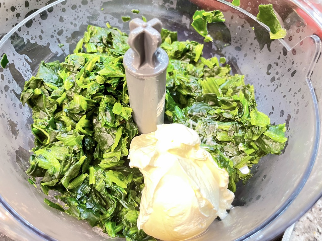 Spinach and sour cream in blender