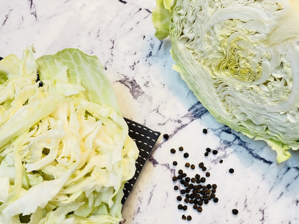 half head of white cabbage on marble bench