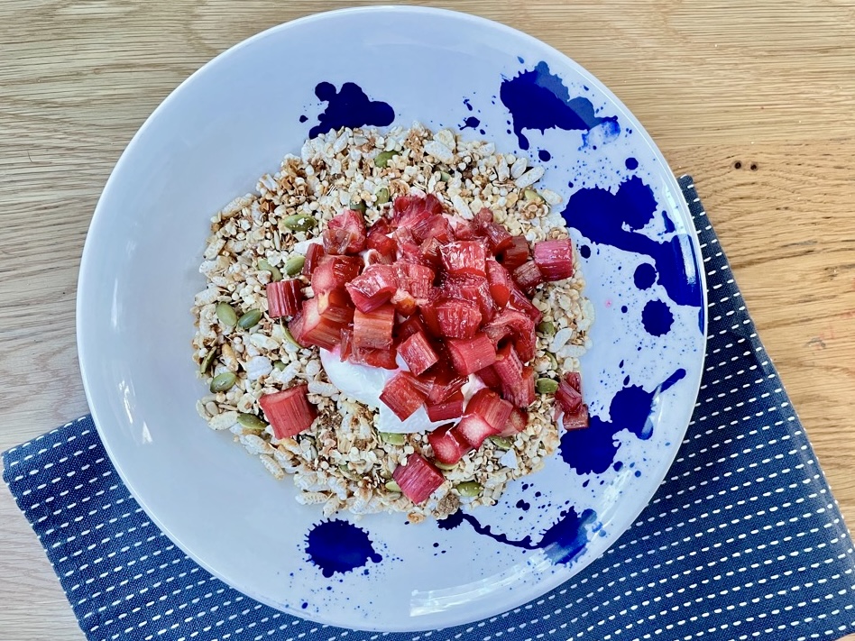 Top down shot of Rustic Rhubarb Granola Bowl on wooden table