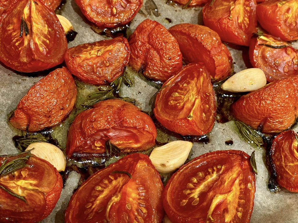 Roasted tomatoes and garlic on tray