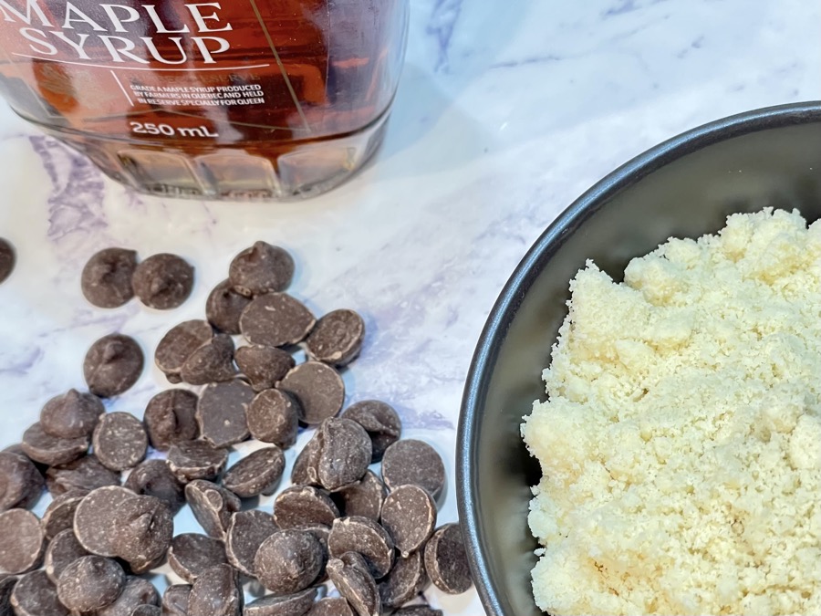 Milk chocolate marzipan ingredients displayed on kitchen bench