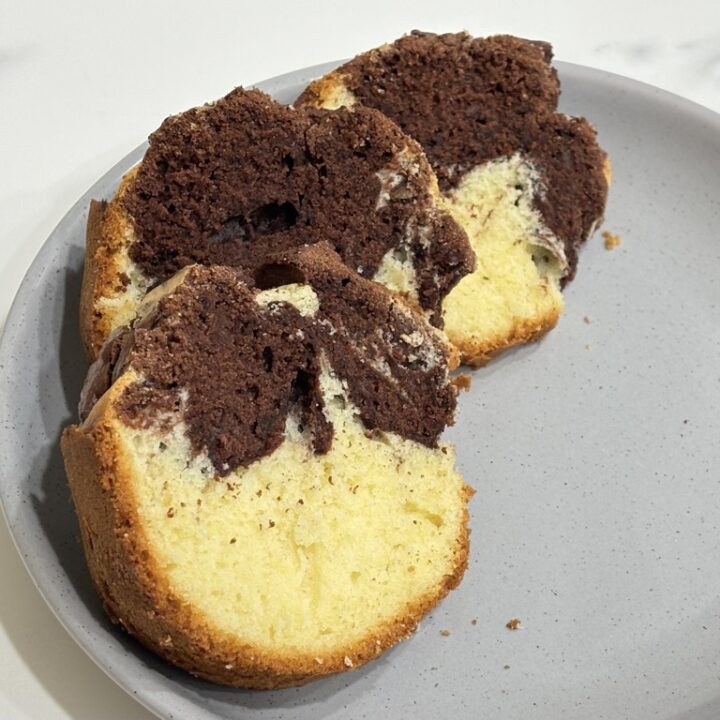 Three slices of marmorkuchen on grey plate