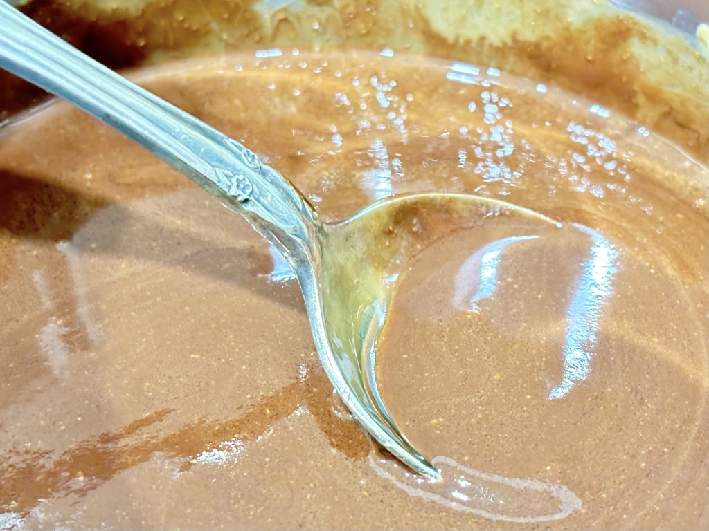 Melted chocolate mix with silver spoon