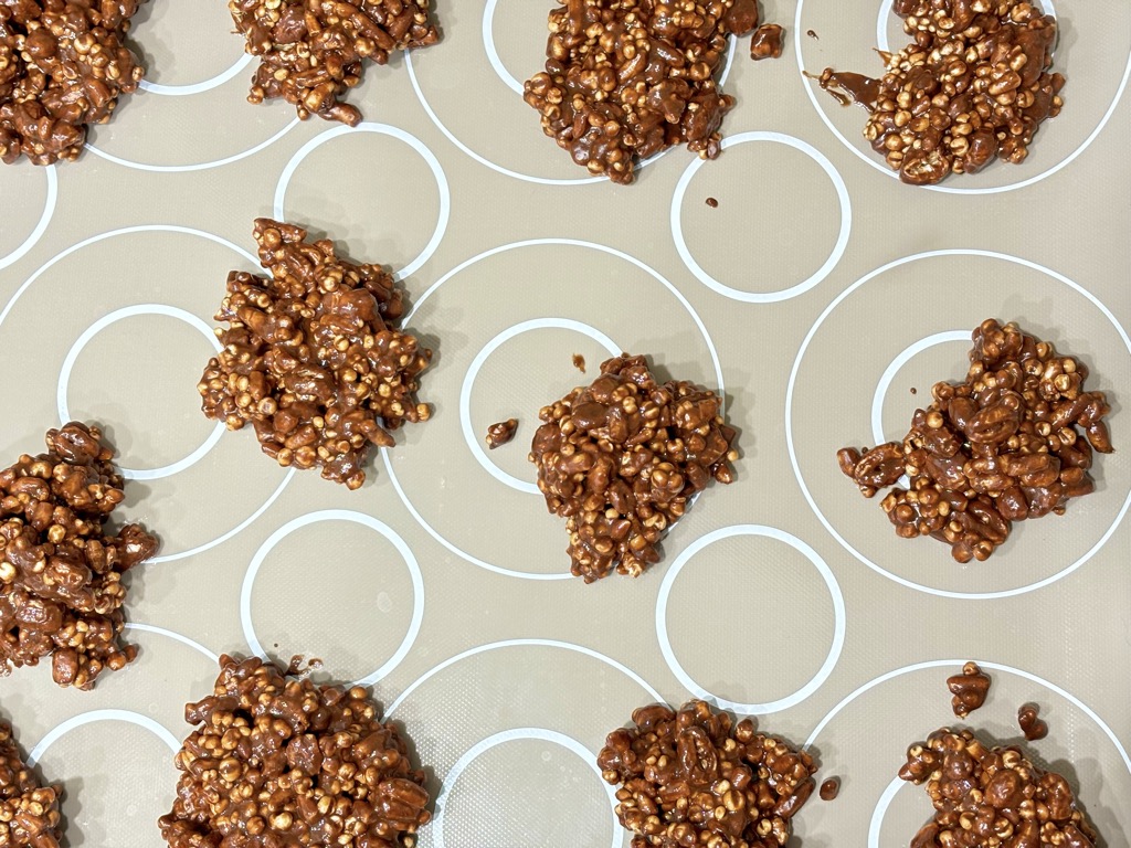 Baking sheet filled with chocolate covered crunch