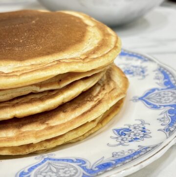 Stack of pancakes on blue and white plate