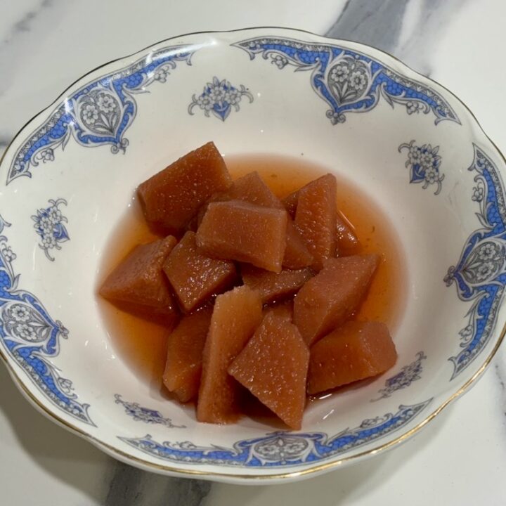 vintage blue and white bowl filled with slow cooked quinces