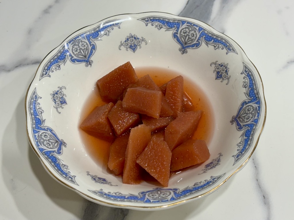 vintage blue and white bowl filled with slow cooked quinces