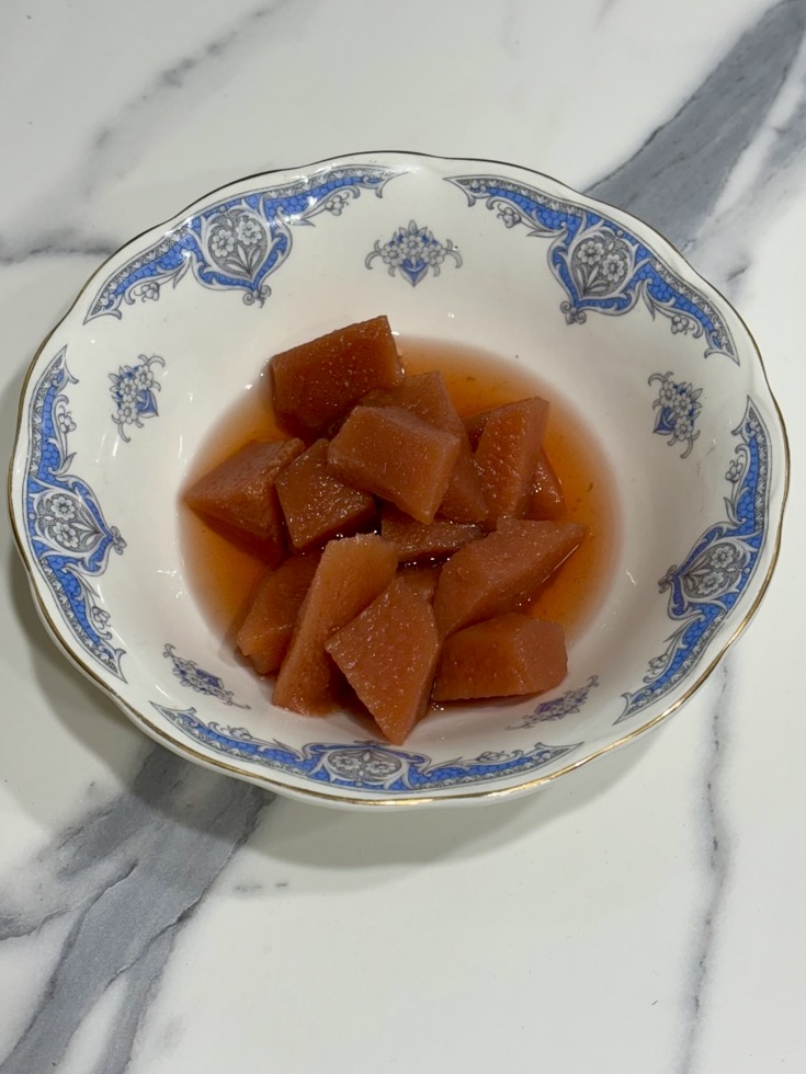 vintage blue and white bowl filled with slow cooked quinces