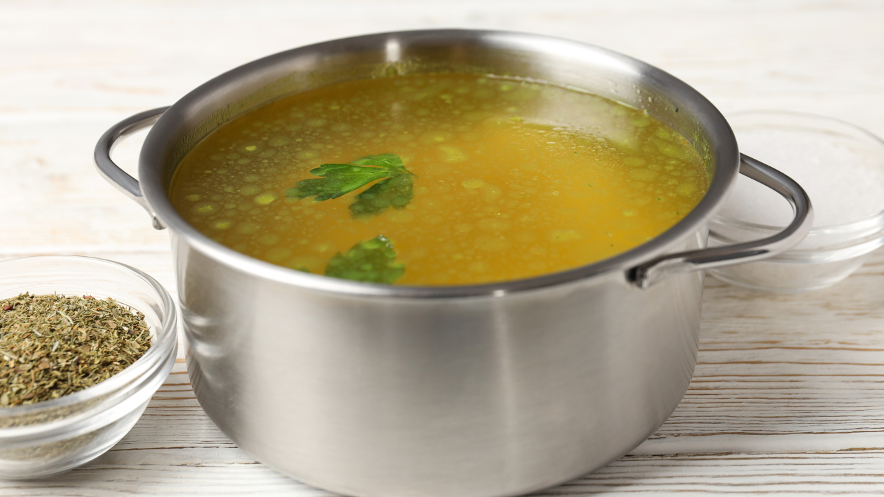 silver pot filled with homemade vegetable broth