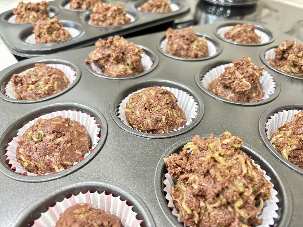 Raw chocolate zucchini batter in muffin tins