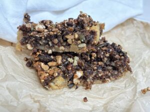 Two sweet and salty granola bars on parchment paper