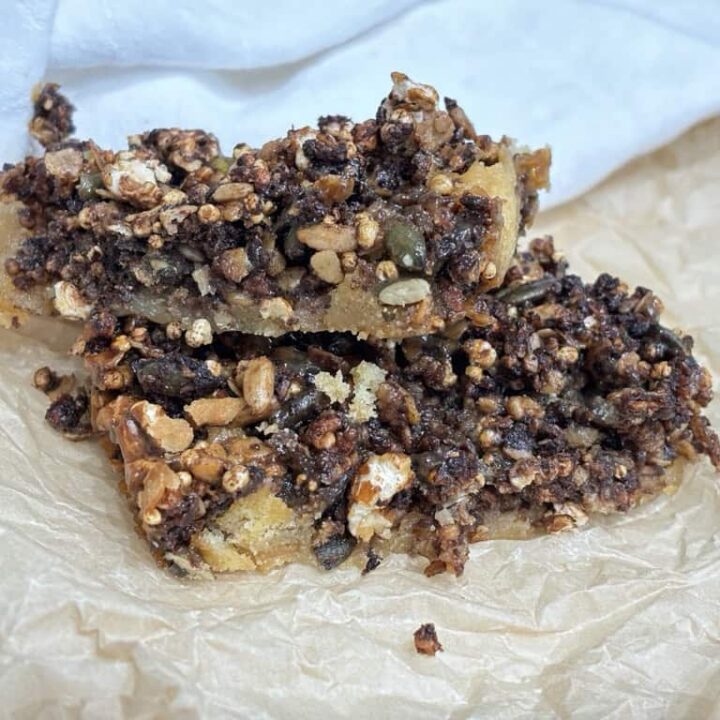 Two sweet and salty granola bars on parchment paper