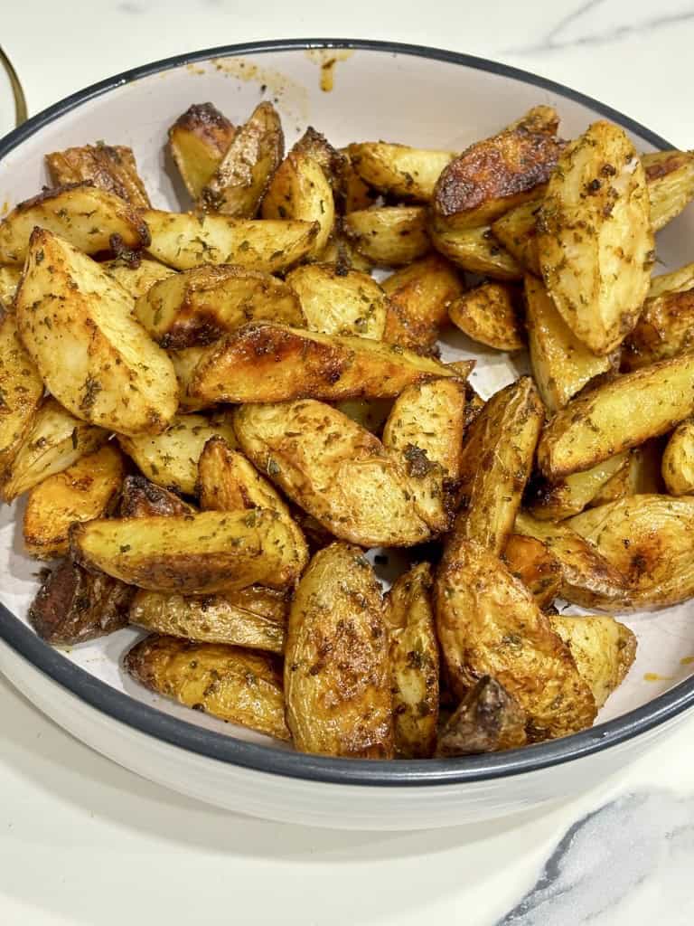 Bowl of Buffalo Wild Wings Potato Wedges on kitchen bench