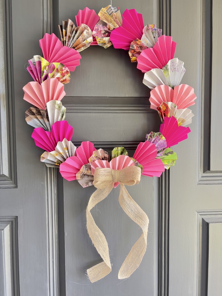 pink paper heart wreath on grey door