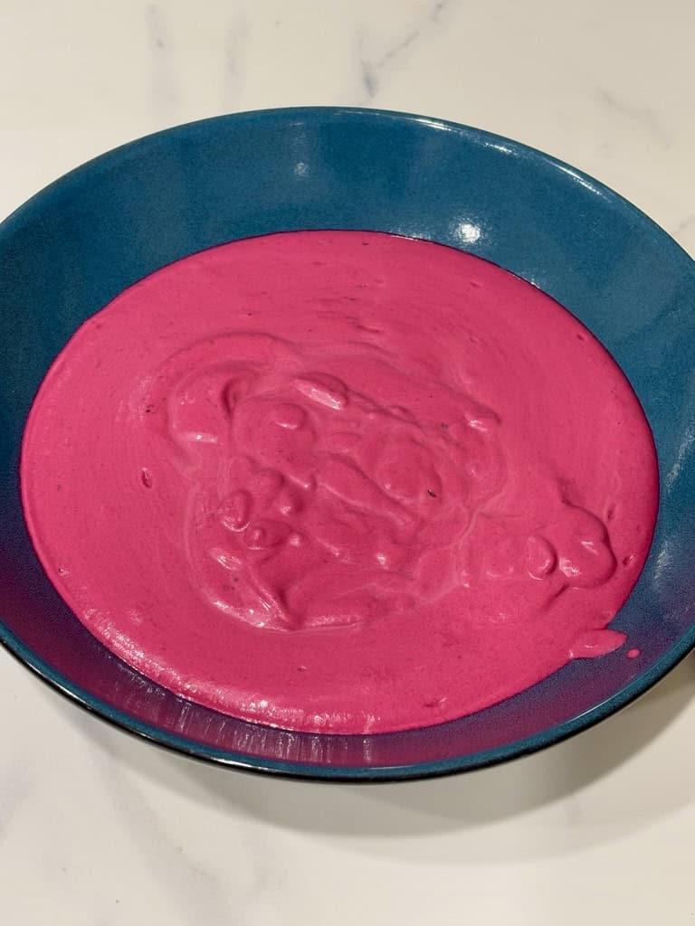 Pink sauce in blue bowl