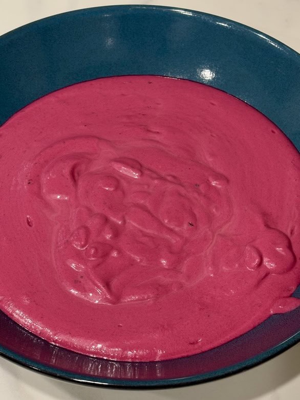 Pink sauce in blue serving bowl