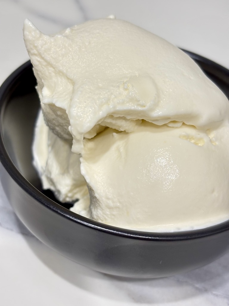 Black bowl filled with ice cream