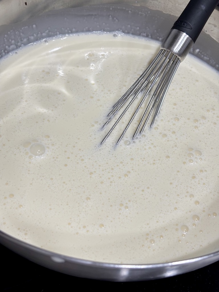 cream mixture in silver bowl