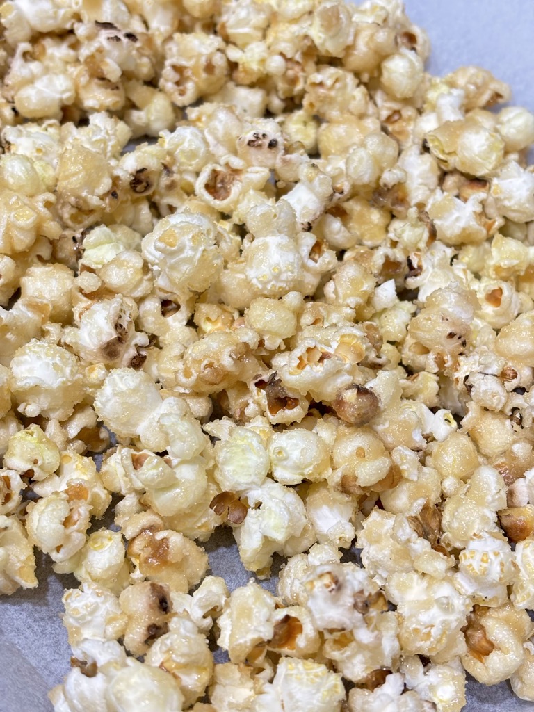 Vegan caramel popcorn on parchment paper