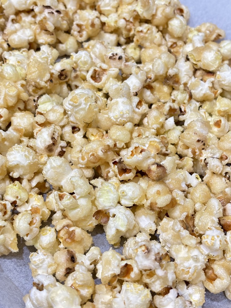 Vegan caramel popcorn on parchment paper