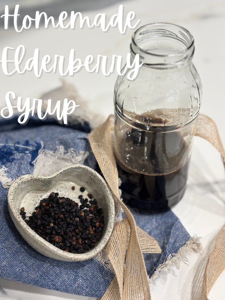 A jar of homemade elderberry syrup displayed alongside dried elderberries, showing the simple ingredients used in this traditional recipe.