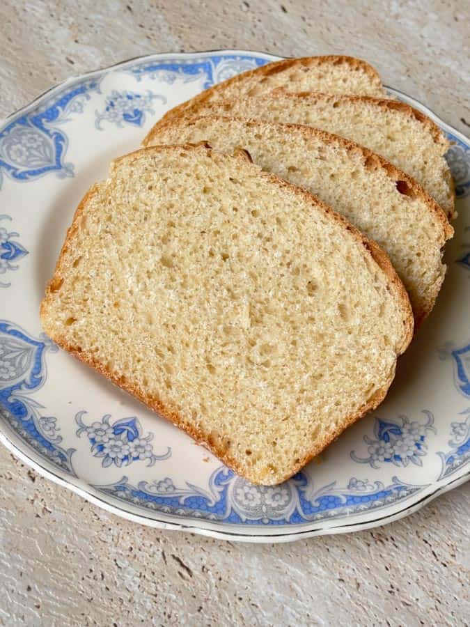 Slices of everyday homemade sandwich bread with a soft crumb and sturdy structure, ideal for school lunches, toast, and french toast.