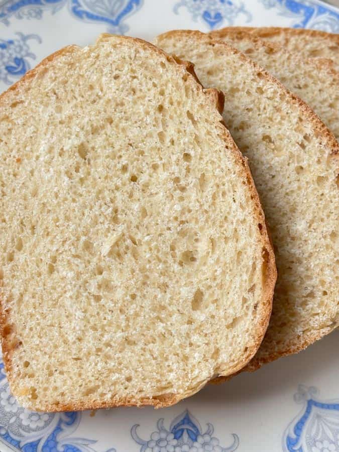 Close-up view of soft white sandwich bread showing an airy, tender crumb and classic homemade loaf texture.