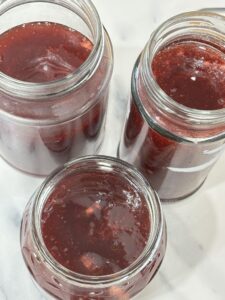 Three jars of small batch strawberry jam made without pectin, perfect for fridge storage, gifting, or enjoying on morning toast.
