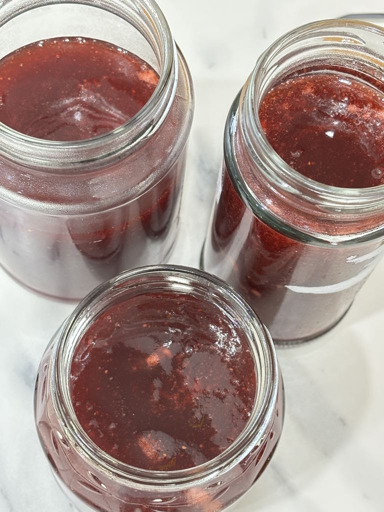 Three jars of small batch strawberry jam made without pectin, perfect for fridge storage, gifting, or enjoying on morning toast.